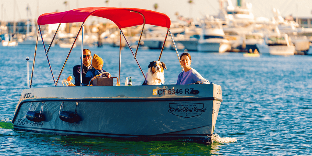 Family riding a Volt 180 Electric Boat in Balboa Harbor
